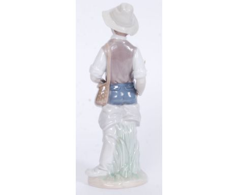 A Lladro figurine ' Going Fishing ' Bearing impressed model  No 4809 with blue stamp to base. Measures 22cms High - Condition