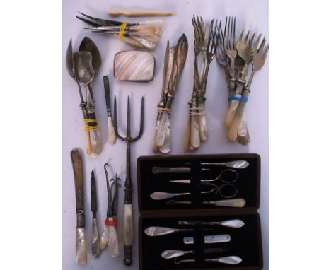 A collection of mother of pearl flatware and other items. To include crochet hooks, button hooks, pickle forks, toasting fork
