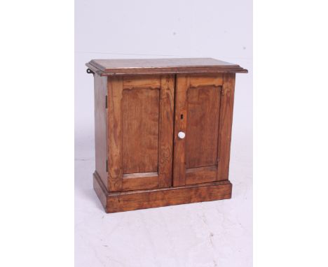 A vintage oak wall hanging medical cabinet having a fully appointed interior consisting of drawers and a lockable cupboard. H