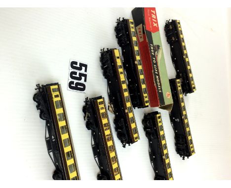 Trix Twin Railway OO Gauge scale-length coaching stock: seven brown/cream Western Region Cars with grey roofs, the majority w