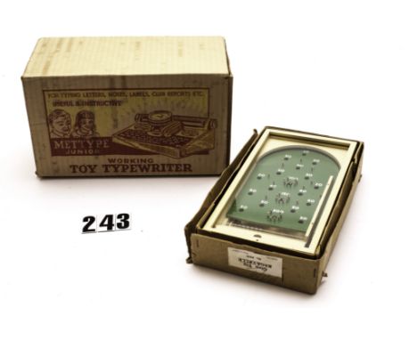 A Mettype Junior Working Typewriter, tinplate toy in original box with instructions, plus Chad Valley glass tp wooden Bagatel