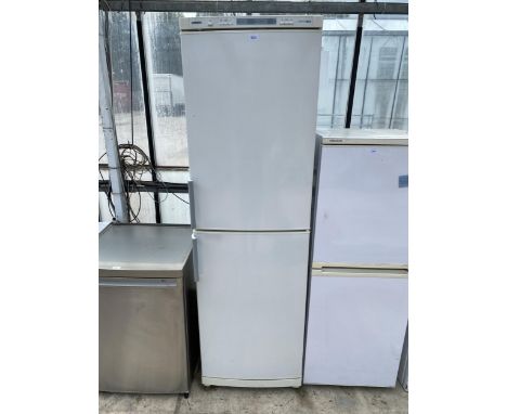 A TALL WHITE UPRIGHT SIEMENS FRIDGE FREEZER BELIEVED IN WORKING ORDER BUT NO WARRANTY