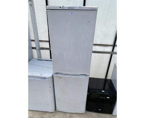 A TALL WHITE HOTPOINT UPRIGHT FRIDGE FREEZER