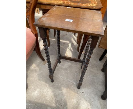 AN OAK EARLY 20TH CENTURY BARLEY-TWIST PLANT STAND