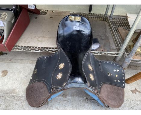 A VINTAGE HORSE SADDLE BEARING A BRASS PLAQUE, PRINCE PRINCESS ROCKING HORSE CREATIONS DESIGNED BY ROYAL MAC SADDLERY