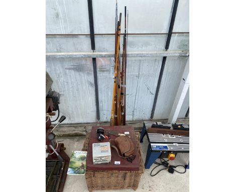 AN ASSORTMENT OF VINTAGE FISHING TACKLE TO INCLUDE RODS, A REEL AND A WICKER TACKLE BOX ETC