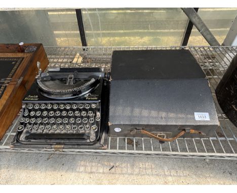 A VINTAGE SMITH PREMIER PORTABLE TYPEWRITER WITH CARRY CASE