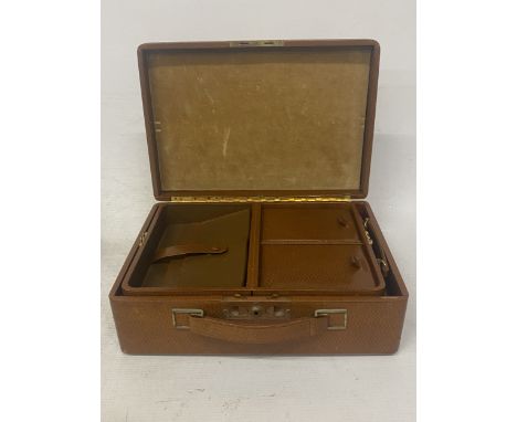 A BROWN LEATHER VANITY CASE WITH INTEGRAL LIFT OUT JEWELLERY BOX