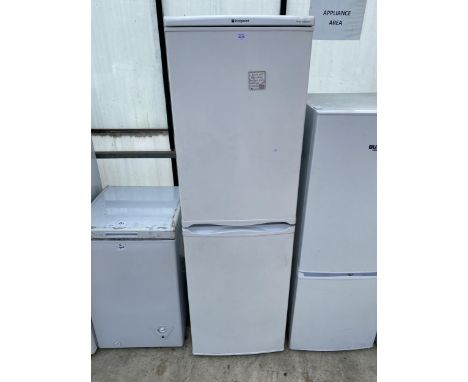 A TALL WHITE HOTPOINT UPRIGHT FRIDGE FREEZER