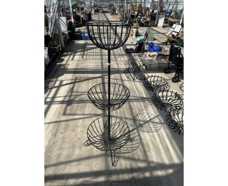A DECORATIVE WROUGHT IRON THREE TIER GRDUATED PLANT STAND