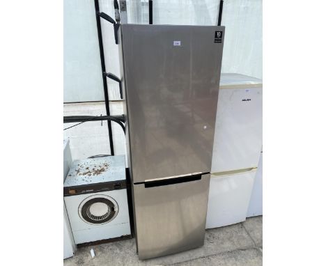 A TALL SILVER UPRIGHT SAMSUNG FRIDGE FREEZER