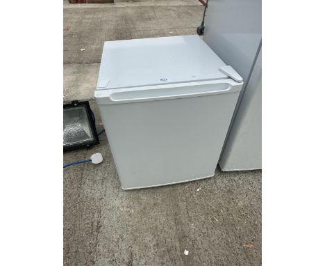 A SMALL WHITE COUNTERTOP FRIDGE