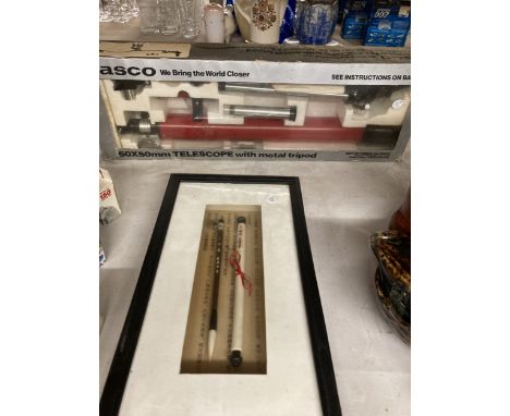 A TASCO 50X50MM TELESCOPE WITH METAL TRIPOD TOGETHER WITH A CHINESE CALLIGRAPHY BRUSH IN A FRAME