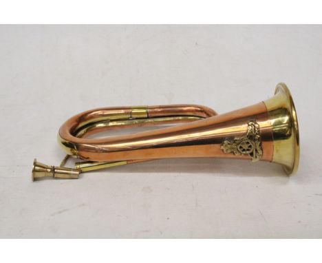 A BRASS AND COPPER ARMY BUGLE