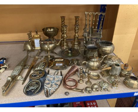 A LARGE COLLECTION OF BRASS AND COPPER ITEMS, TO INCLUDE CANDLESTICKS, HORSE BRASSES, VASES, MINIATURE ROCKING CHAIR ETC
