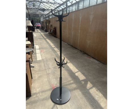 A MODERN BLACK PAINTED COAT AND HAT STAND