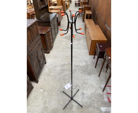 A RETRO MID 20TH CENTURY METALWARE BLACK PAINTED COAT/STICK STAND WITH ORANGE TERMINALS