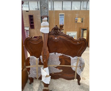 A VICTORIAN STYLE CONTINENTAL 5' BEDSTEAD WITH CARVED TOP RAIL AND FOOT