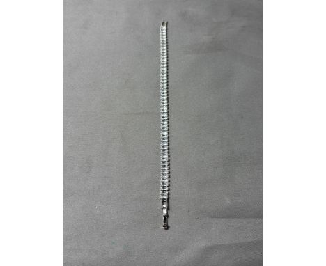 A MARKED 925 CUBIC ZIRCONIA TENNIS BRACELET. IN A PRESENTATION BOX.