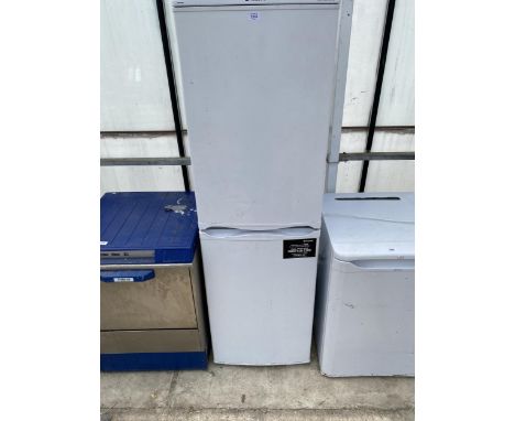 A WHITE HOTPOINT UPRIGHT FRIDGE FREEZER