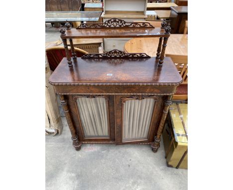A VICTORIAN WALNUT CHIFFONIER WITH TWO GLAZED DOORS TO BASE, RAISED BACK WITH TURNED COLUMNS AND FRETWORK PANELS 37" WIDE