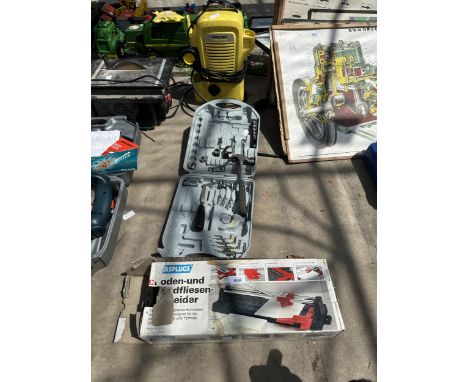 AN ASSORTMENT OF TOOLS TO INCLUDE A SPANNER SET, TILE CUTTER AND KARCHER PRESSURE WASHER