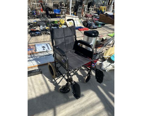 AN INVACARE BEN9+ FOLDING WHEELCHAIR