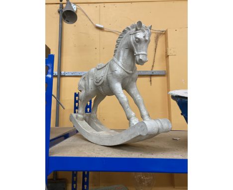 A HEAVY DECORATIVE ROCKING HORSE 15"x14"
