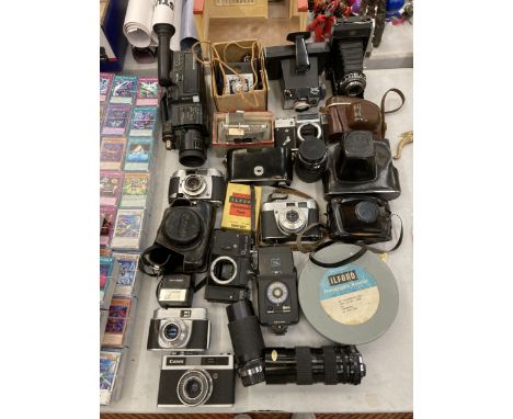 A LARGE COLLECTION OF VINTAGE CAMERAS AND PHOTOGRAPHY EQUIPMENT TO INCLUDE CANON, ZENIT, KODAK ETC