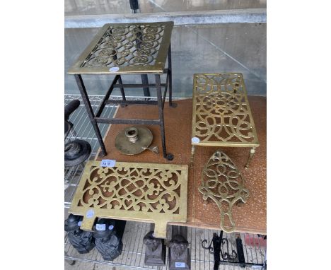 THREE VINTAGE BRASS TRIVET STANDS, A BRASS WALL HANGING TRIVET AND A CANDLEHOLDER ETC