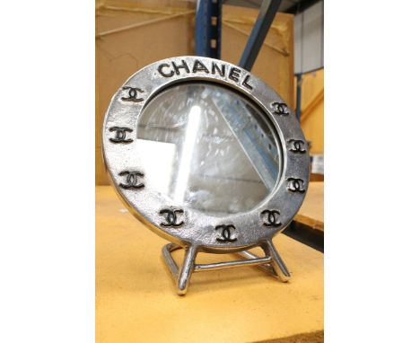 A CHROME CHANEL STYLE MIRROR