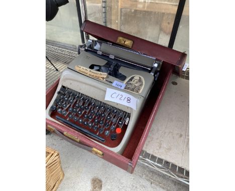AN OLIVETTE STUDIO 44 TYPEWRITER WITH CARRY CASE