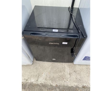 A SMALL BLACK ELECTRIQ COUNTERTOP FRIDGE