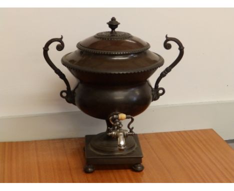 A Regency bronze samovar with silver plated tap.