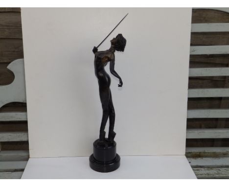 A bronze study of a female sword fencer wearing high heels, on circular black marble base,  21" overall height.