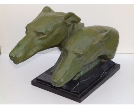 M. Bertin - a green painted bronze study of two greyhound heads, signed, on rectangular black marble base, 19" across.