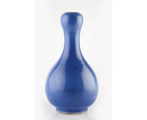 A Chinese pear shaped bottle vase 19th Century with waisted garlic mouthed neck decorated with a monochrome sky blue glaze, f