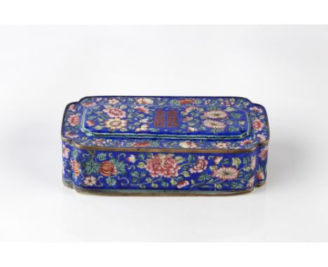 A Chinese Canton enamel pen box late 19th Century the blue ground cover painted with flowers and central inscription with fit