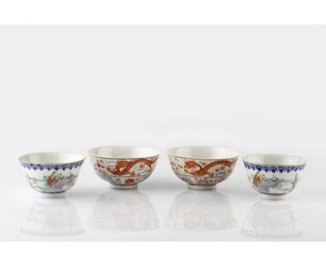 A pair of Chinese circular enamel bowls 19th Century each with blue ruyi border and figures at a table opening a hand scroll,