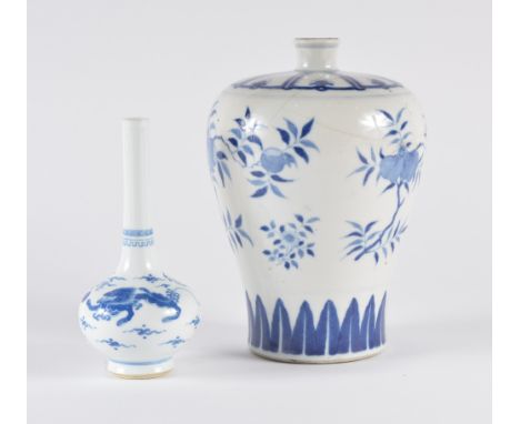 A Chinese blue and white bottle vase late 19th Century decorated dogs of fo guarding flaming pearls amidst scattered cloud mo