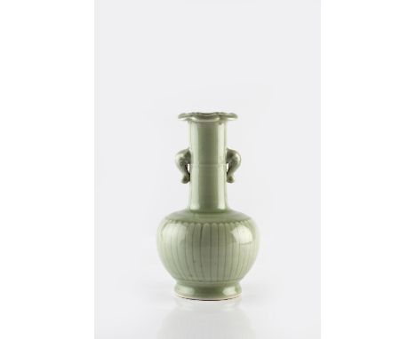 A Chinese celadon bottle vase 20th Century the globular body moulded with narrow petalled band supporting a cylindrical eleph