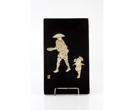 A Japanese bone and lacquer panel late 19th/early 20th Century signed, showing a man with a rice box and a child with a paras