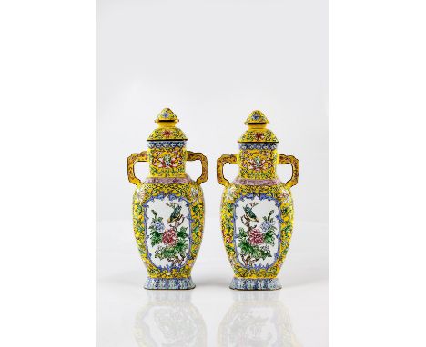 A pair of Chinese yellow ground enamel two handled vases 19th/20th Century each of flattened form with reserve panel decorate