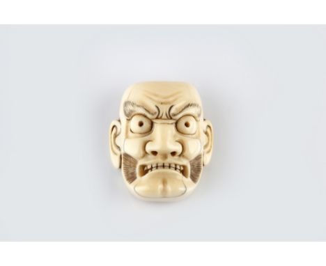 An ivory netsuke mask probably of Kentoku mid 19th Century signed Hojitsu, with strong facial expression with moustache and l