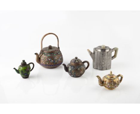 Four Chinese enamel teapots 19th/20th Century and a Chinese Paktong hexagonal teapot with green hardstone handle, spout and f