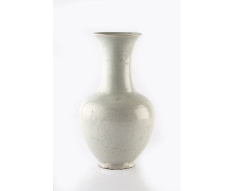 A Chinese Ding ware crackled glazed baluster vase late Song incised with a linear floral motif, 26cm