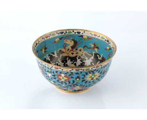 A Chinese cloisonne enamel bowl 1900-1920 decorated in Ming style with lotus flowers and scattered petals on a blue ground, r