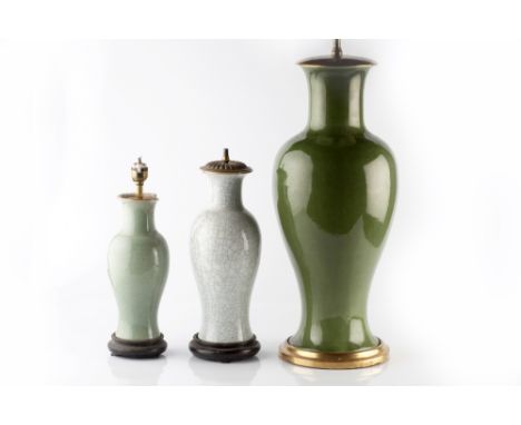 A Chinese green baluster vase 19th/20th Century converted to a lamp, 55cm, and two smaller green Chinese vases/lamps, 35cm an