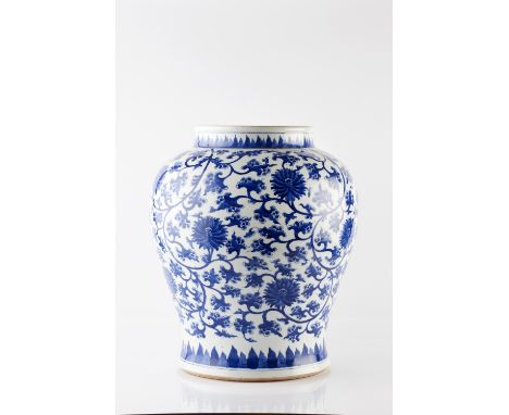 A Chinese blue and white vase 20th Century decorated in the 17th style with peony and scroll work, 42cm high