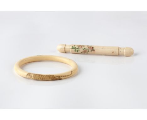 A Japanese ivory bangle Meiji period carved with two tigers, a netsuke, three rabbit mounted okimonos and one other piece